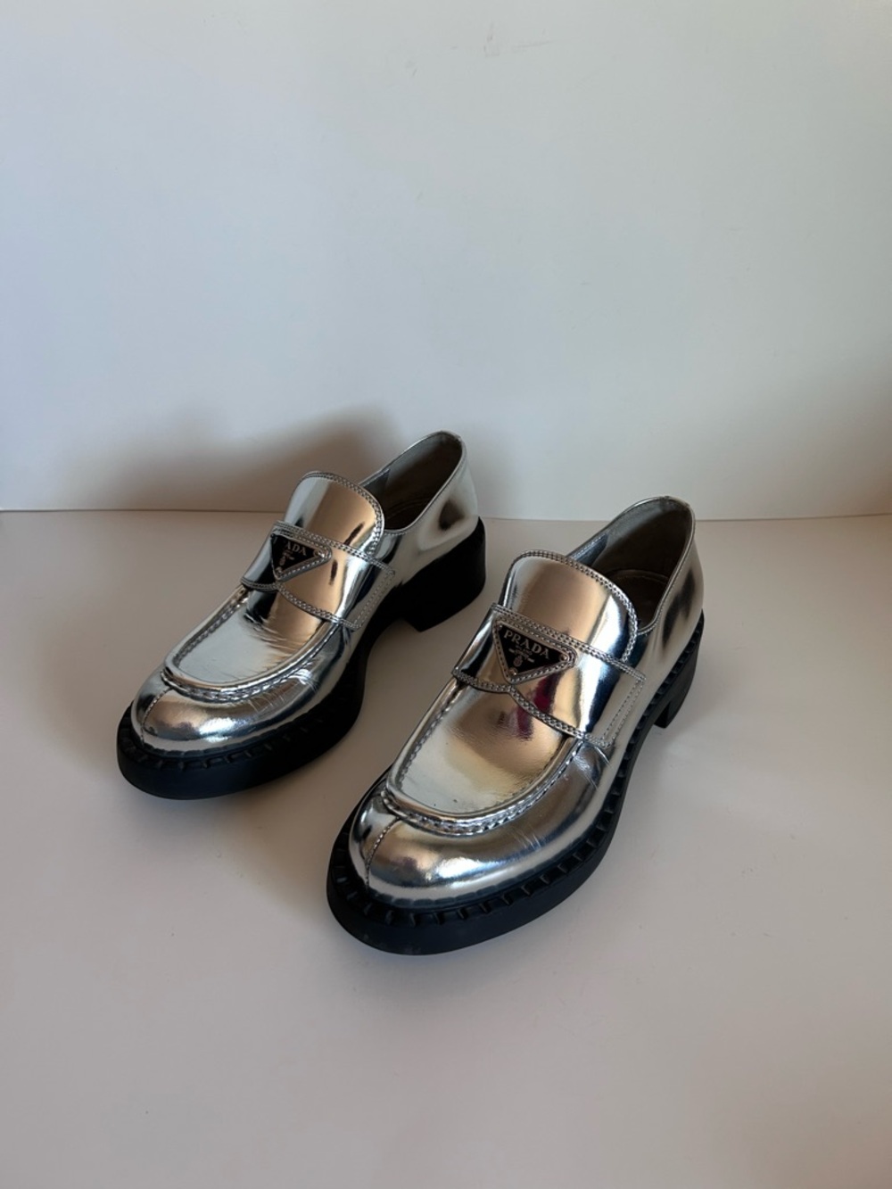 Prada Metallic Silver Penny Loafers with Black Lug Soles